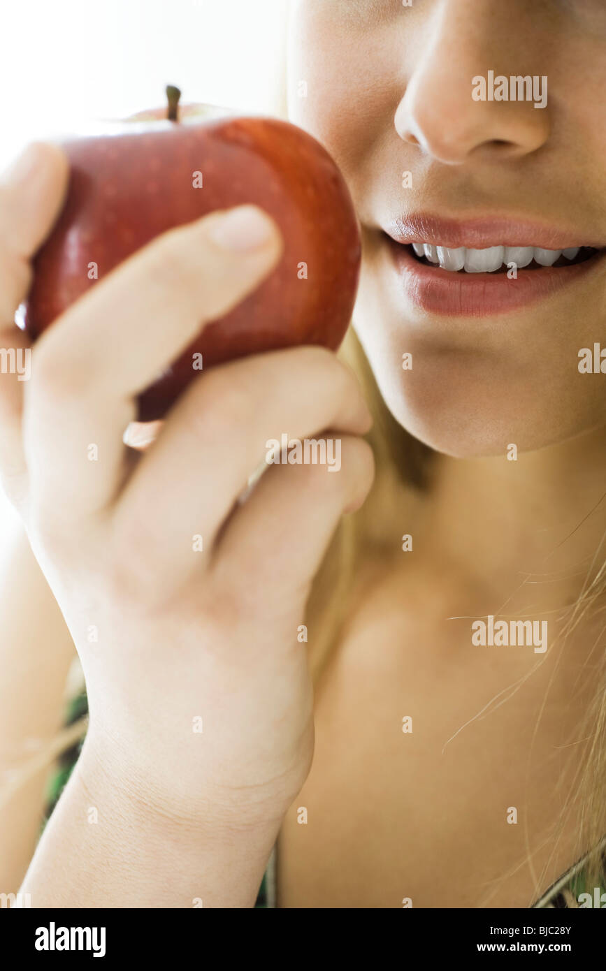 Young woman eating apple Stock Photo