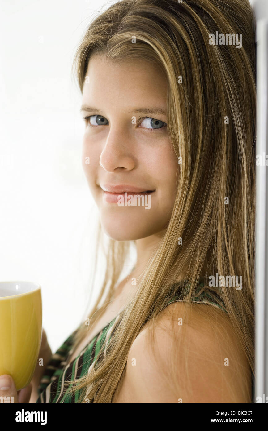 Young woman with cup of coffee, portrait Stock Photo