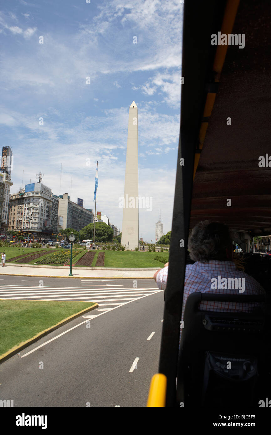 middle aged tourist on guided bus tour past the obelisk capital federal buenos aires republic of argentina south america Stock Photo