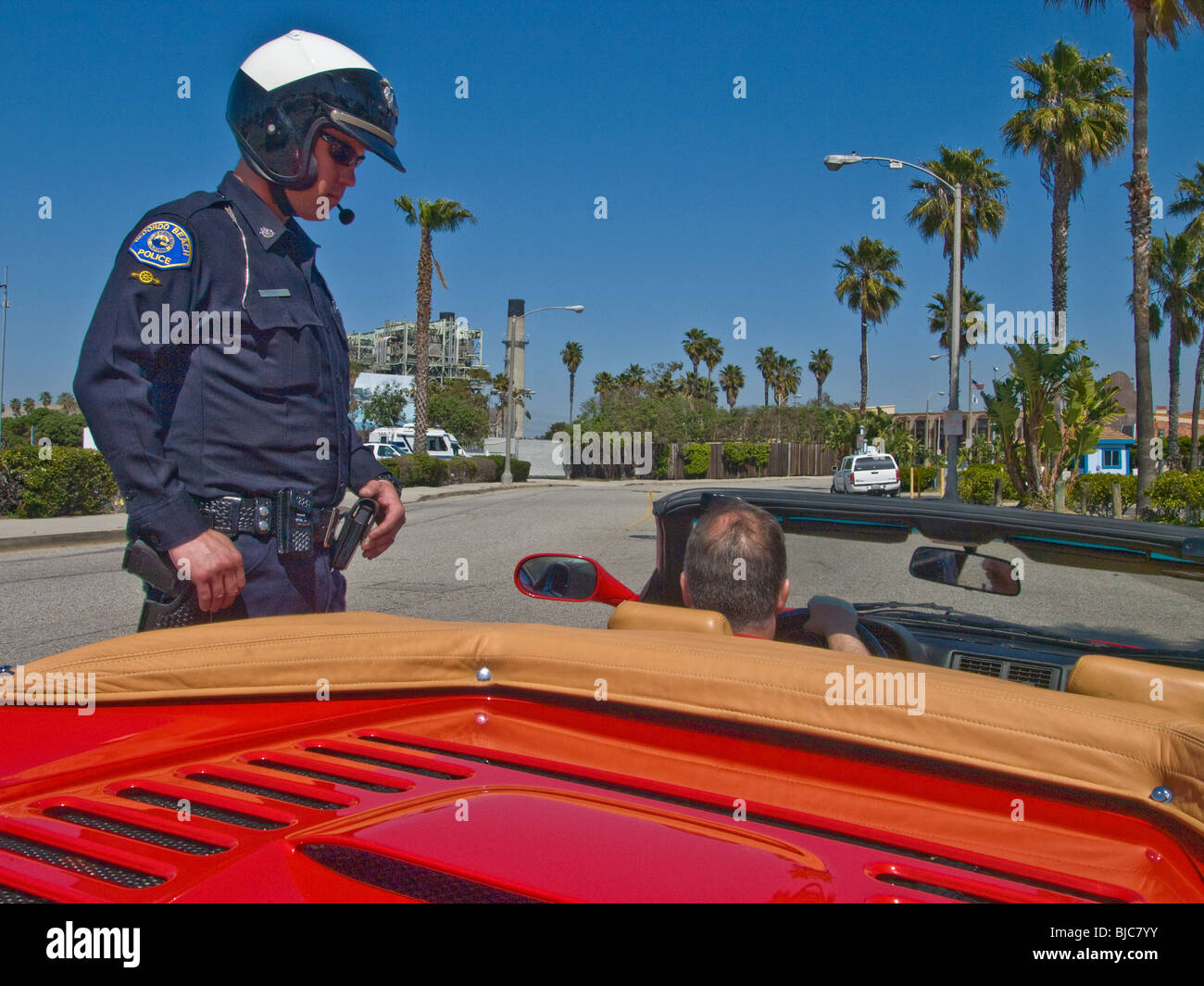 Motor officer confronts possible law breaker Stock Photo
