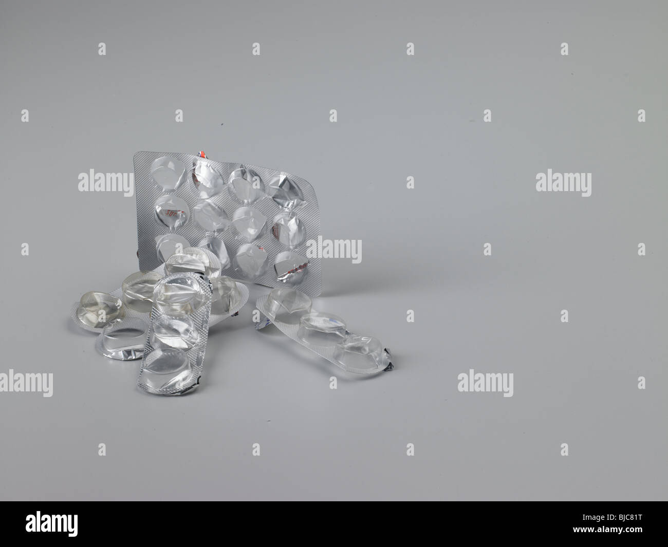 Waste pharmaceutical foil and plastic blister packaging shot in medium