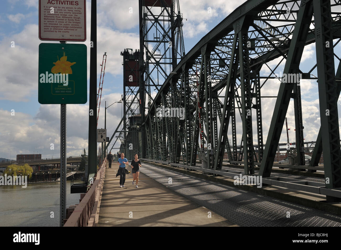Joggers on the Hawthorne Bridge across the Willamette River, Portland, OR 100304 34930 Stock Photo