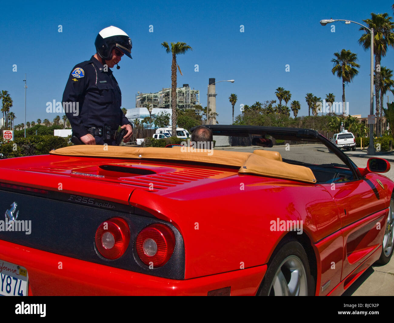 Motor officer confronts possible law breaker Stock Photo