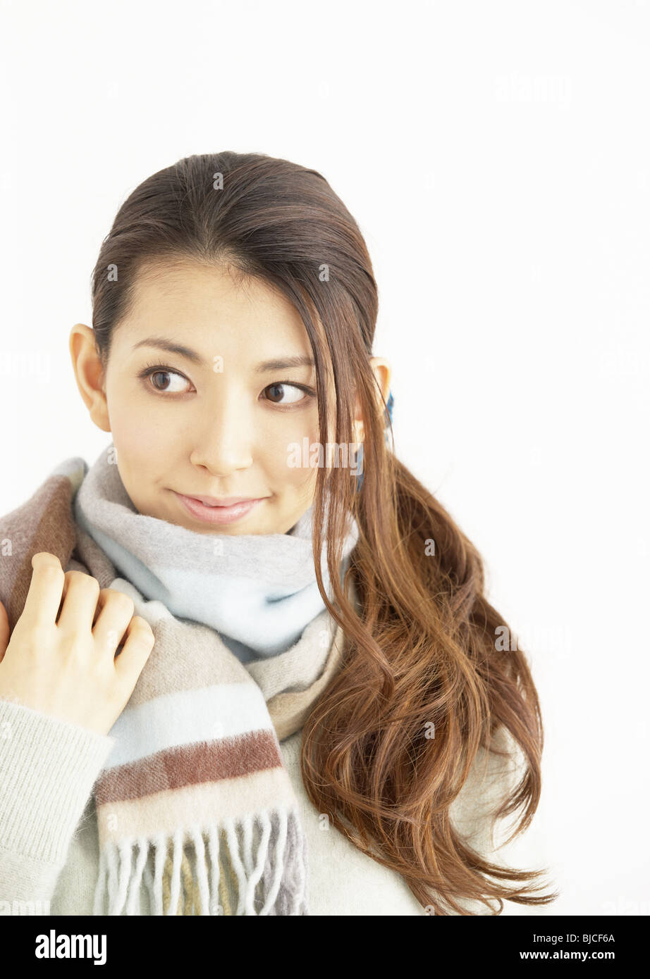 A young woman wearing a muffler Stock Photo Alamy