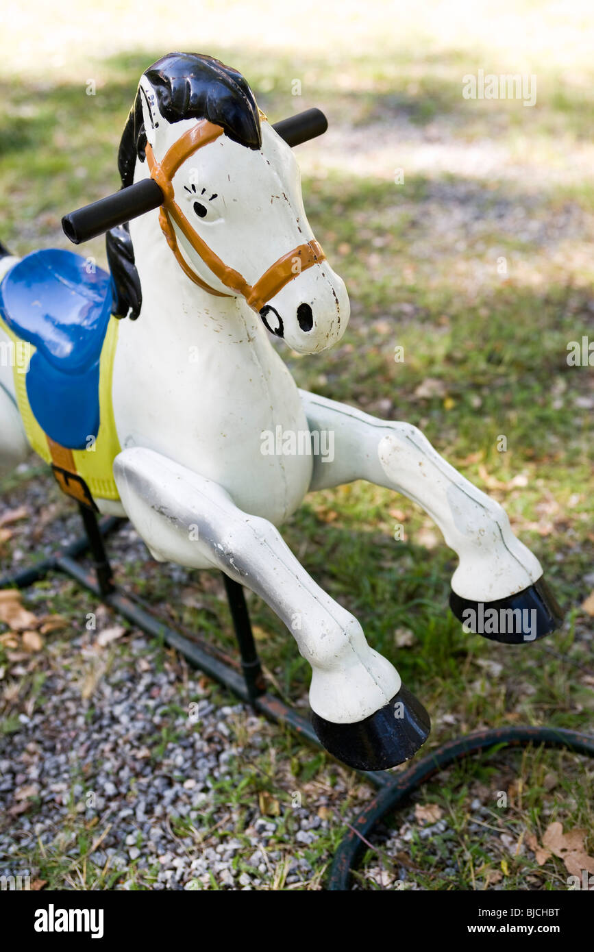 Rocking horse in park Stock Photo