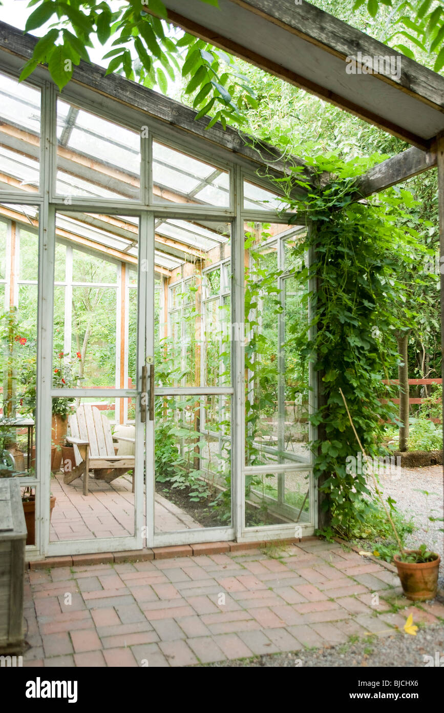 Trellis shaded terrace in front of greenhouse Stock Photo Alamy