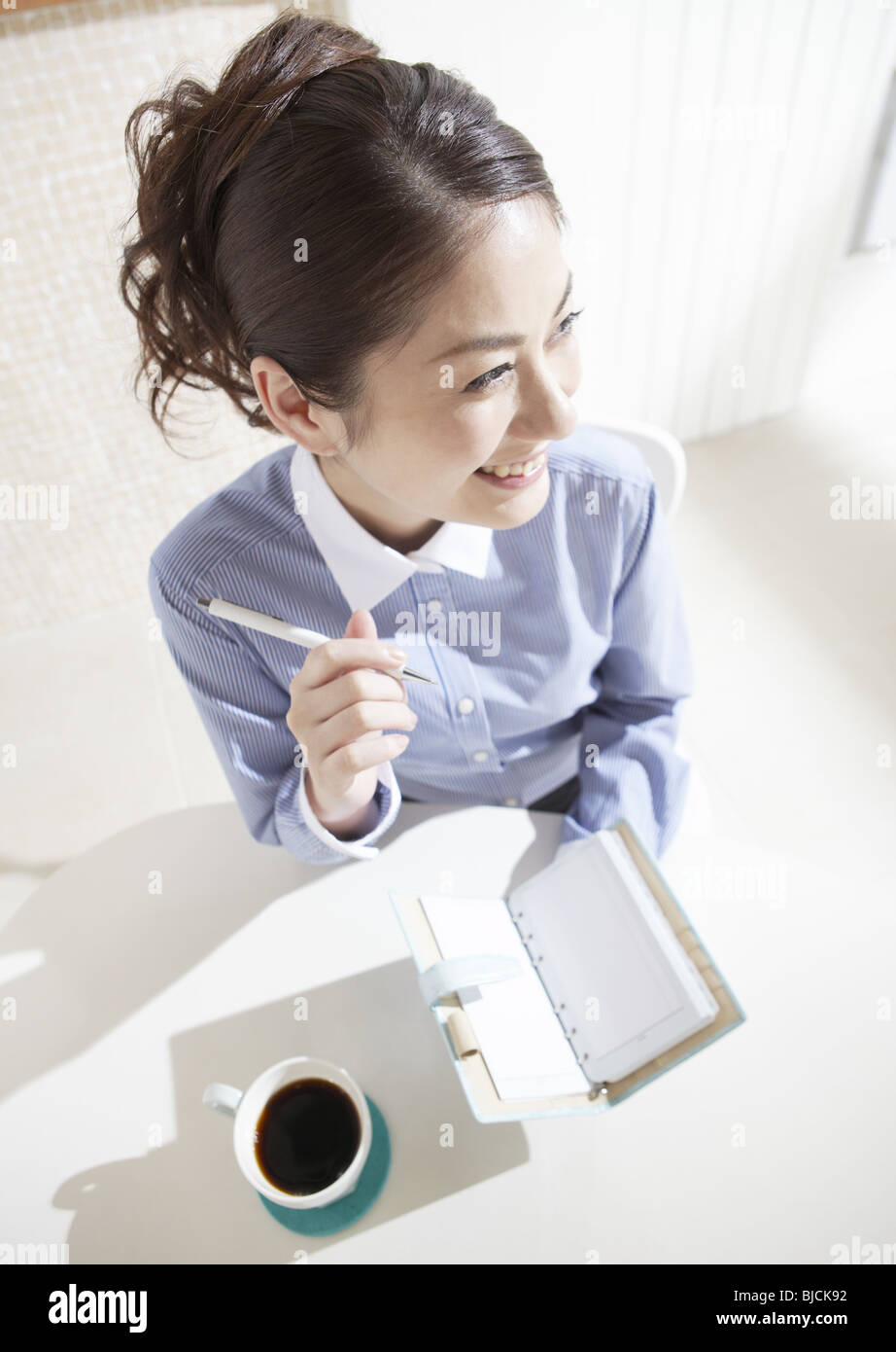 A woman taking a note Stock Photo