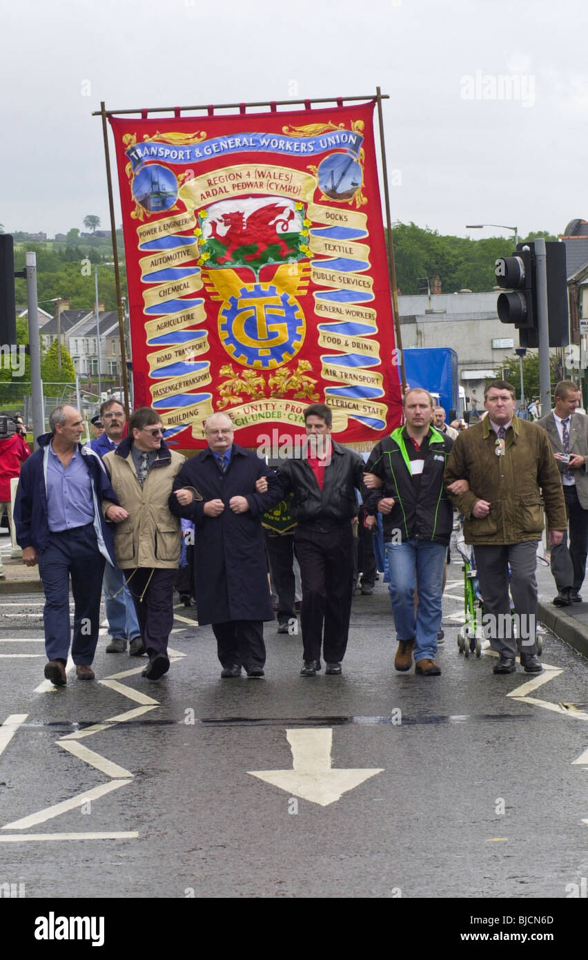 TGWU officials lead a march from Corus Bryngwyn through Gorseinon on the day the steel plant closed. Stock Photo