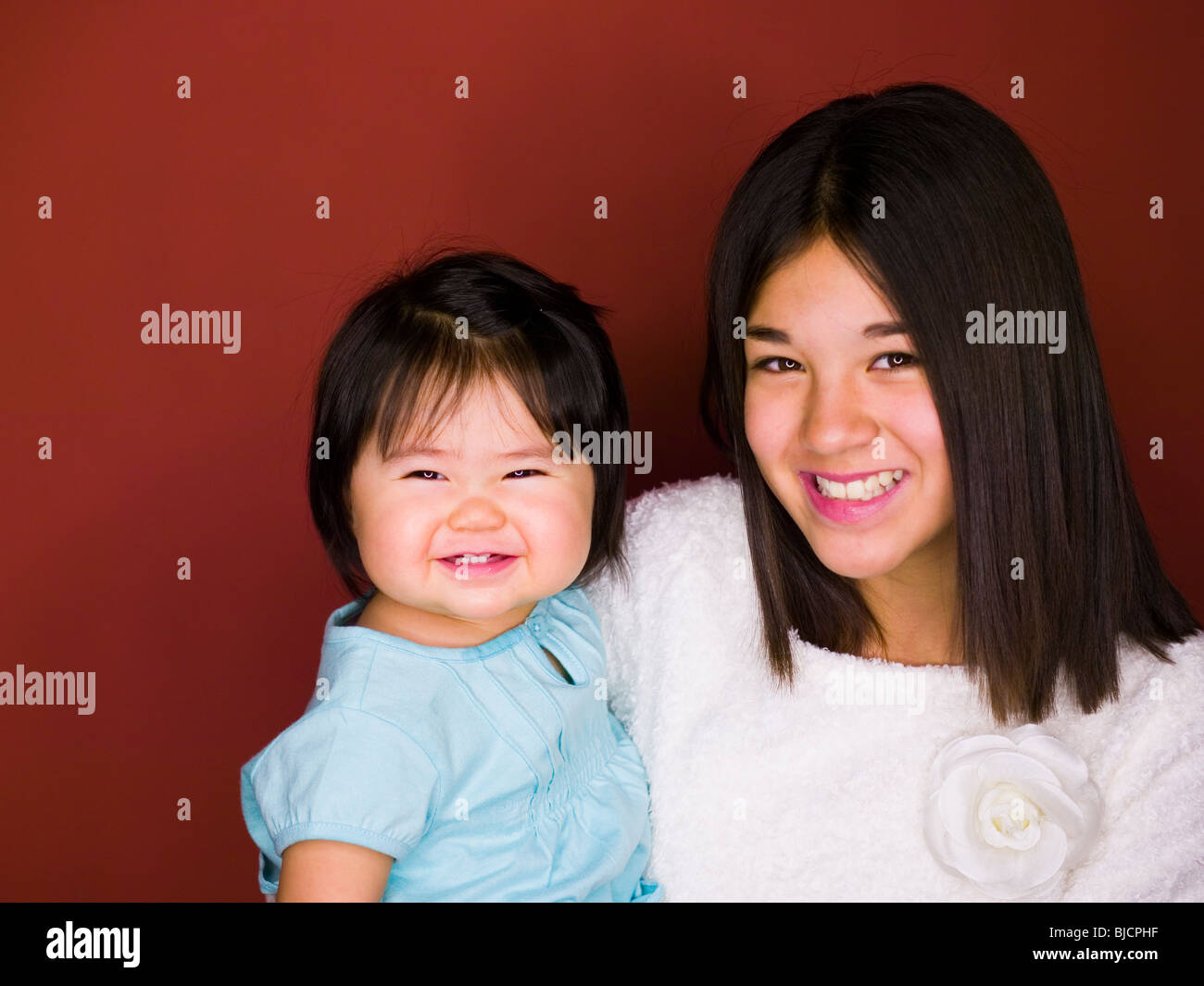Sisters smiling Stock Photo