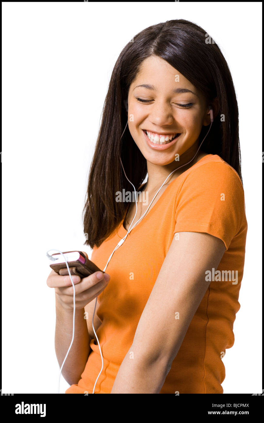Girl listening to mp3 player Stock Photo