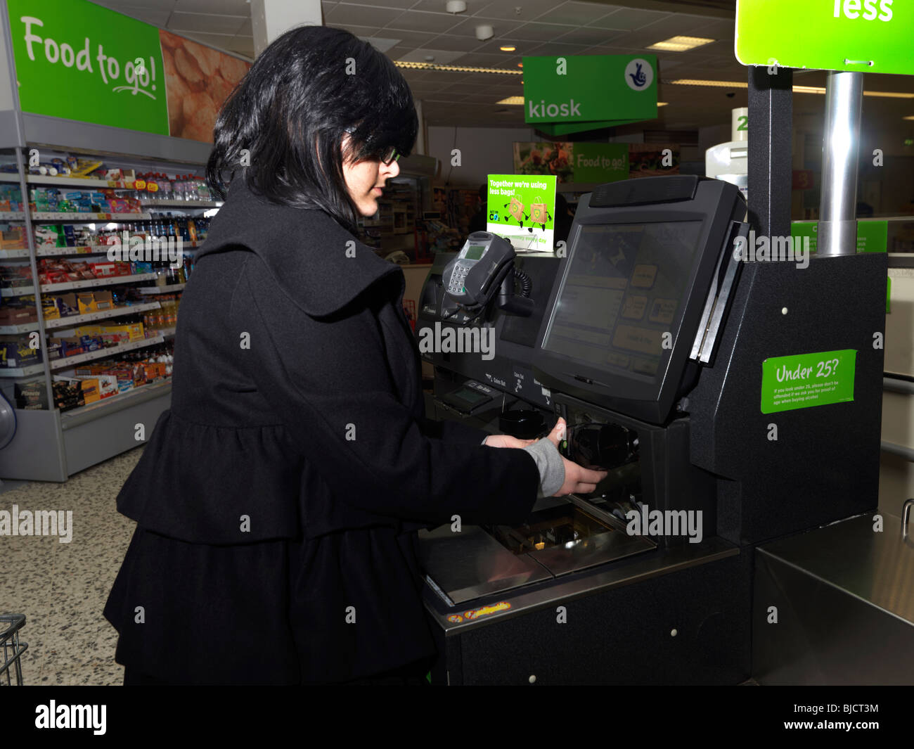 Scanning a Jar of Coffee at the Self Checkout at a Supermarket Stock Photo