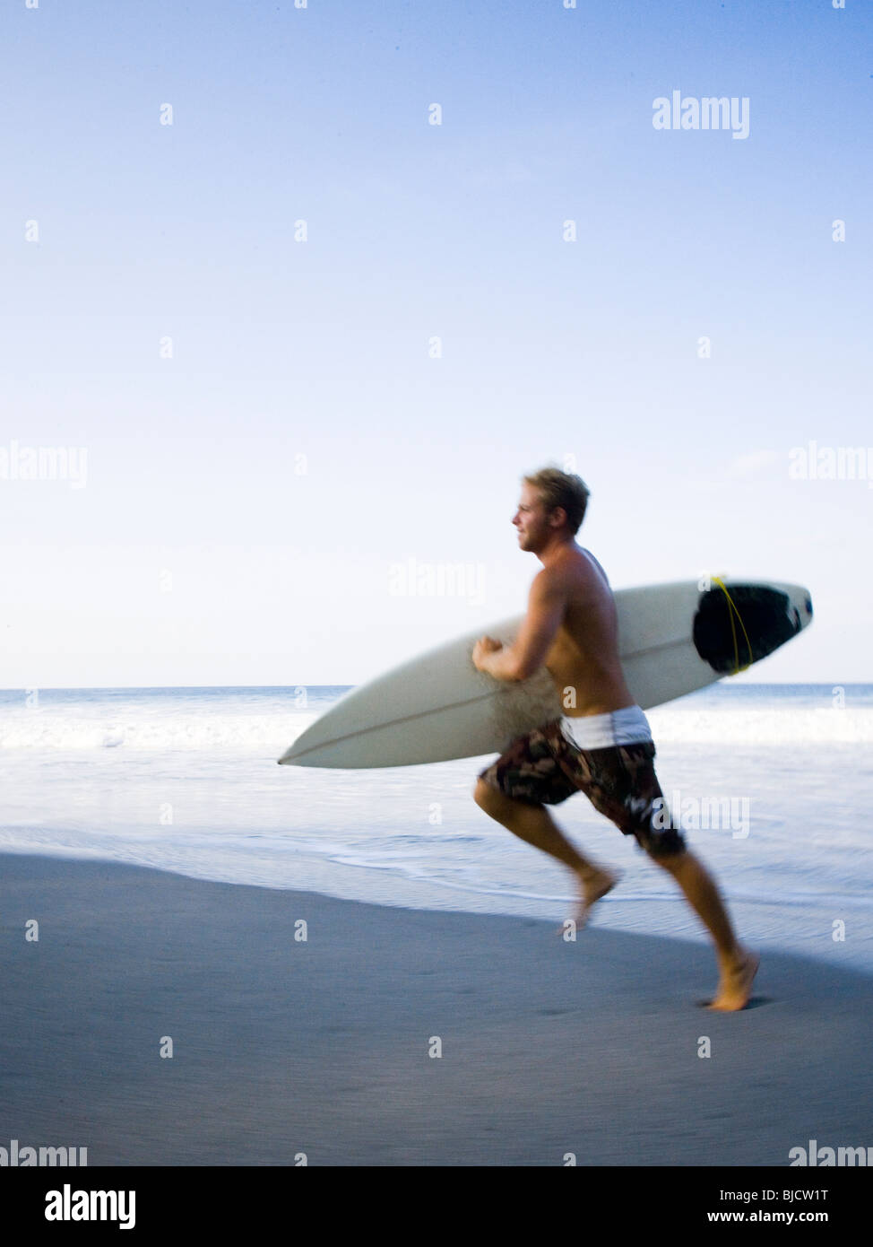 Surfer rinning Stock Photo