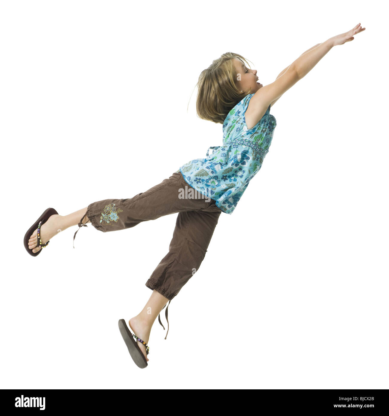 Young girl flying through the air Stock Photo Alamy