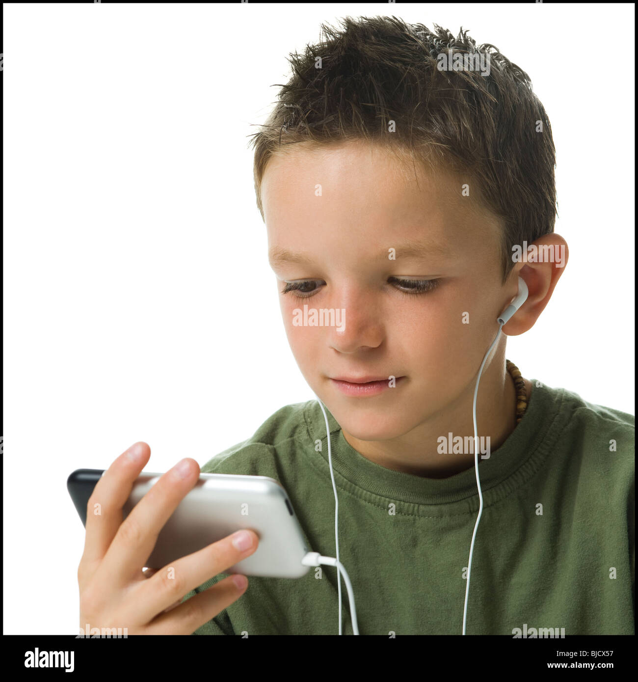 Boy listening to MP3 player Stock Photo Alamy
