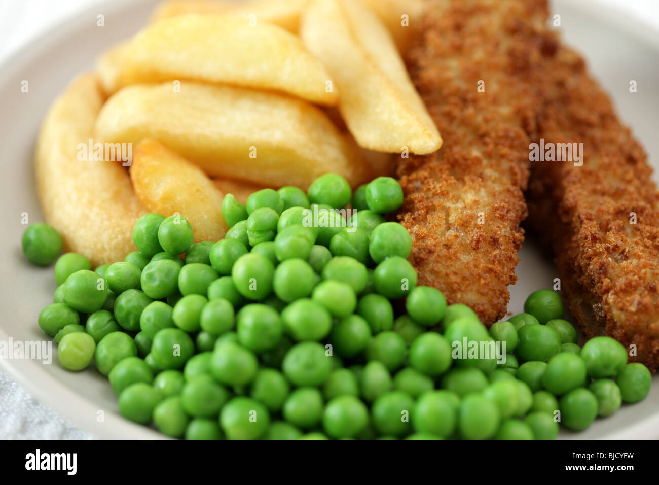 Deep Fried Fish Fingers With Chunky Potato Chips and Peas Served On A