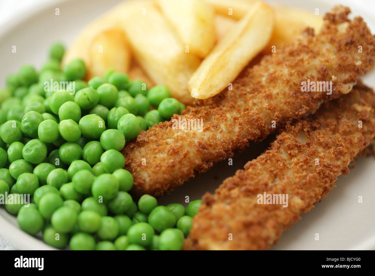 Deep Fried Fish Fingers With Chunky Potato Chips and Peas Served On A