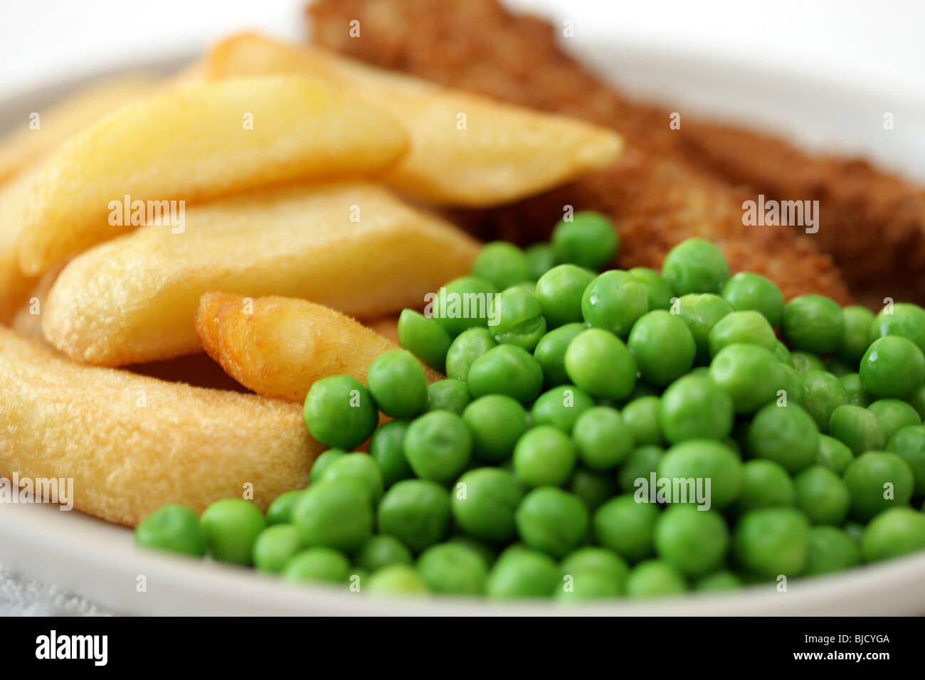 Deep Fried Fish Fingers With Chunky Potato Chips and Peas Served On A