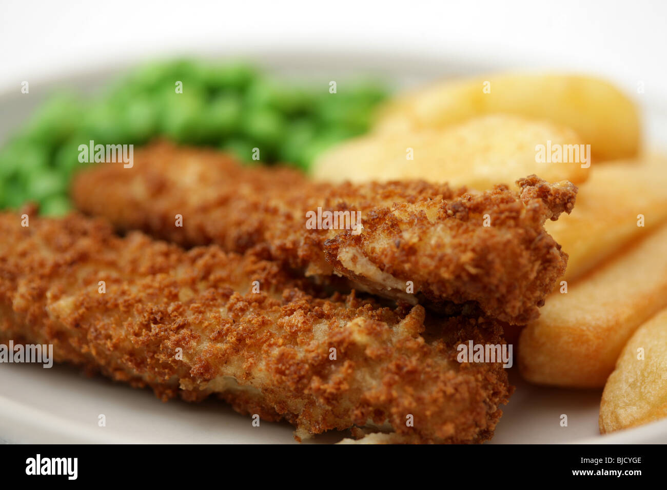 Deep Fried Fish Fingers With Chunky Potato Chips and Peas Served On A