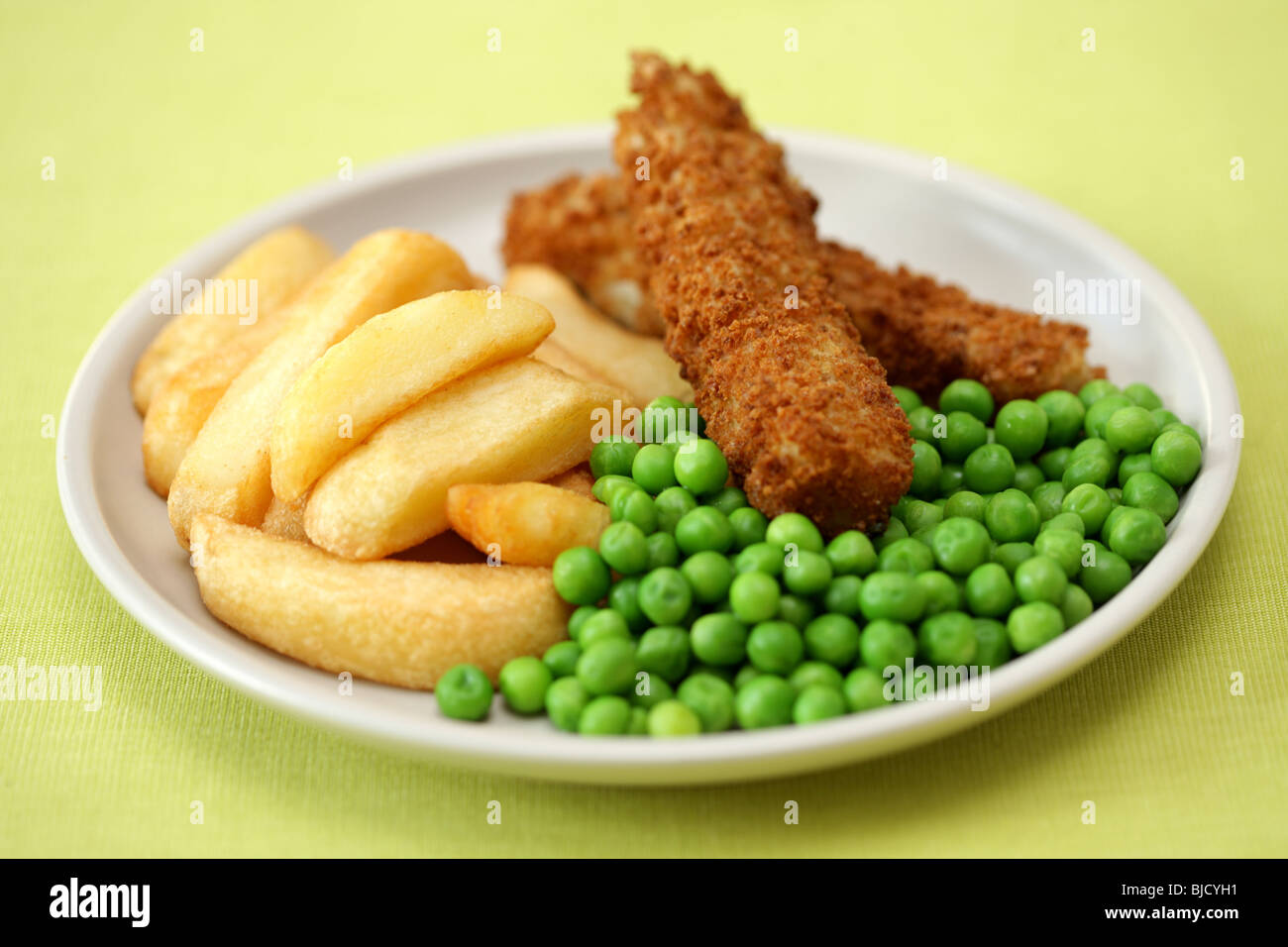 Deep Fried Fish Fingers With Chunky Potato Chips and Peas Served On A