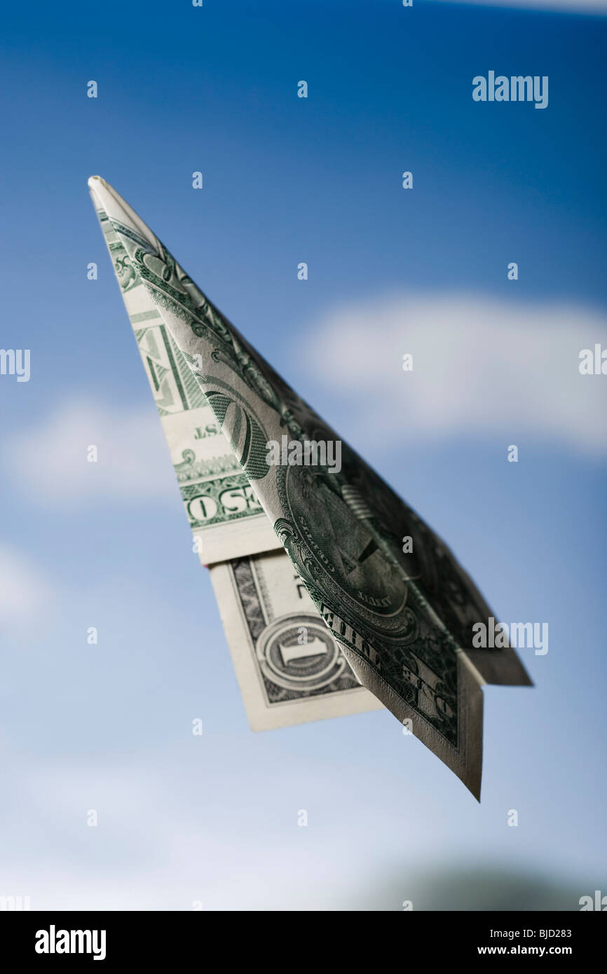 Paper airplane made out of money. Stock Photo
