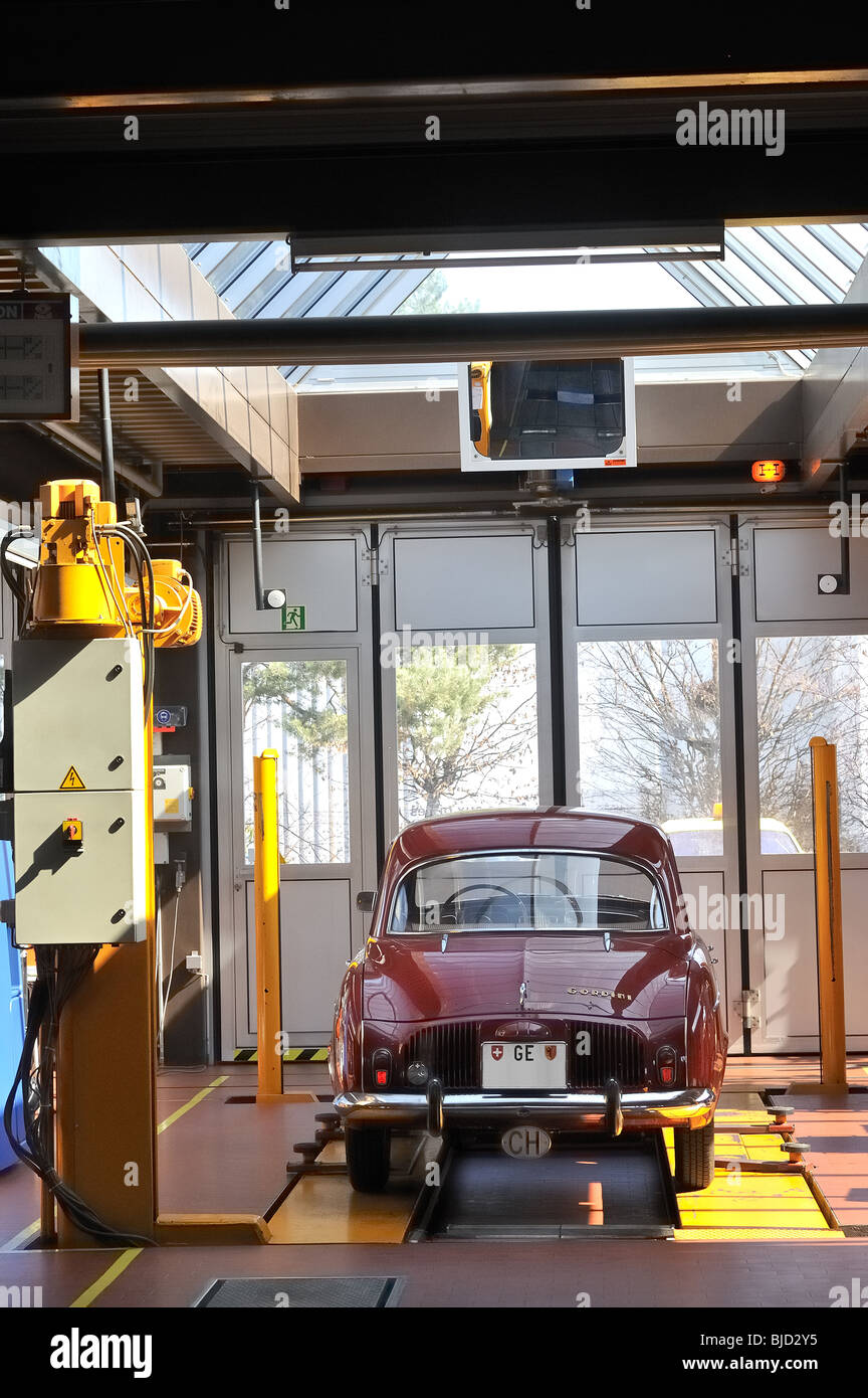 A Peugeot vintage (1950’s) car going through inspection in Geneva