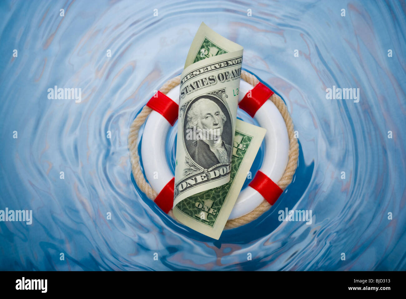 Money in a life saver. Stock Photo