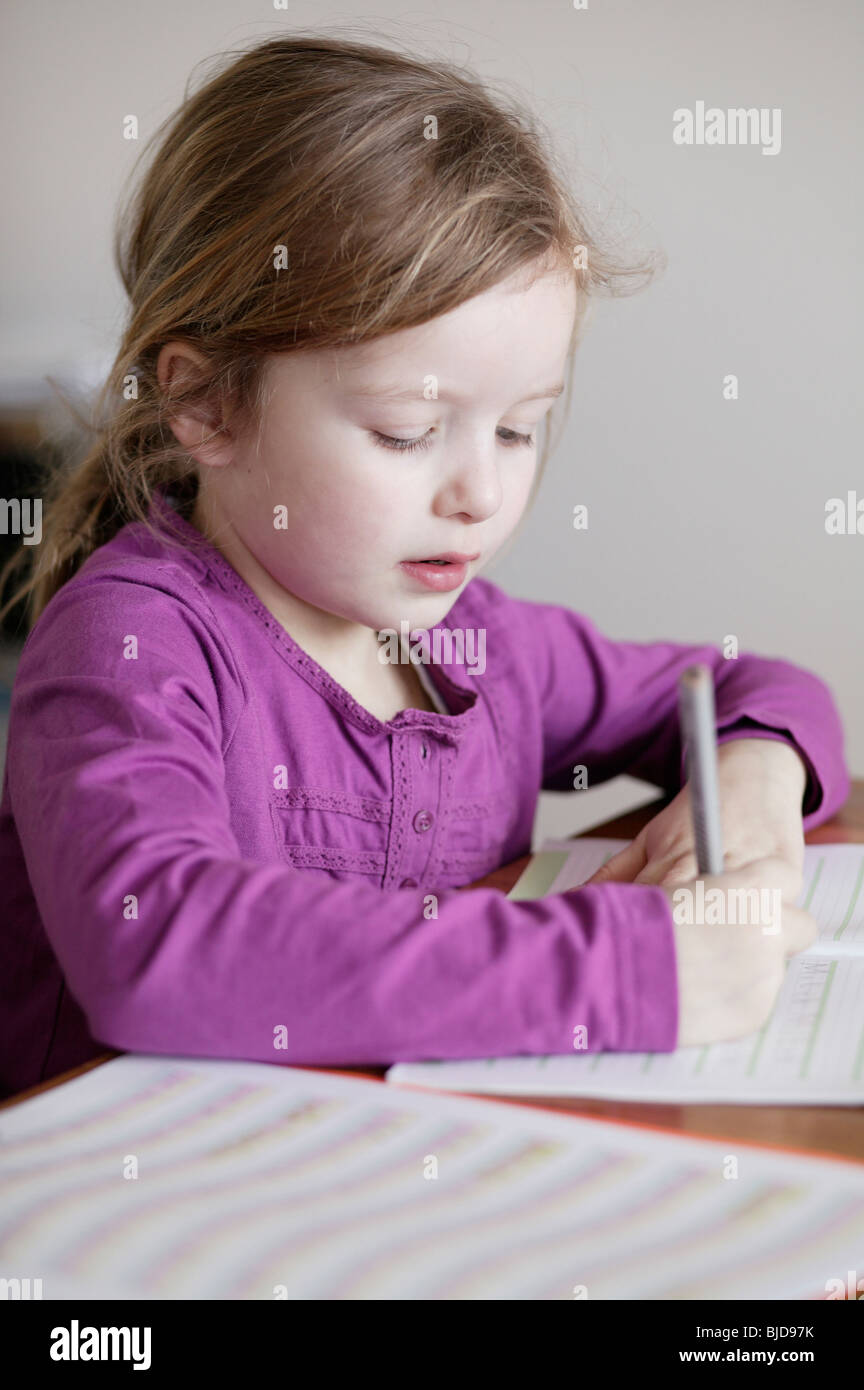 A little girl practices writing Stock Photo Alamy