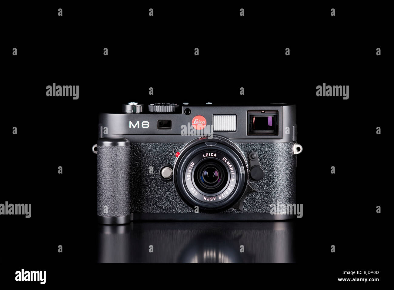 Black studio photograph of a Leica M8 digital rangefinder camera with hand grip and 28mm Elmarit lens Stock Photo