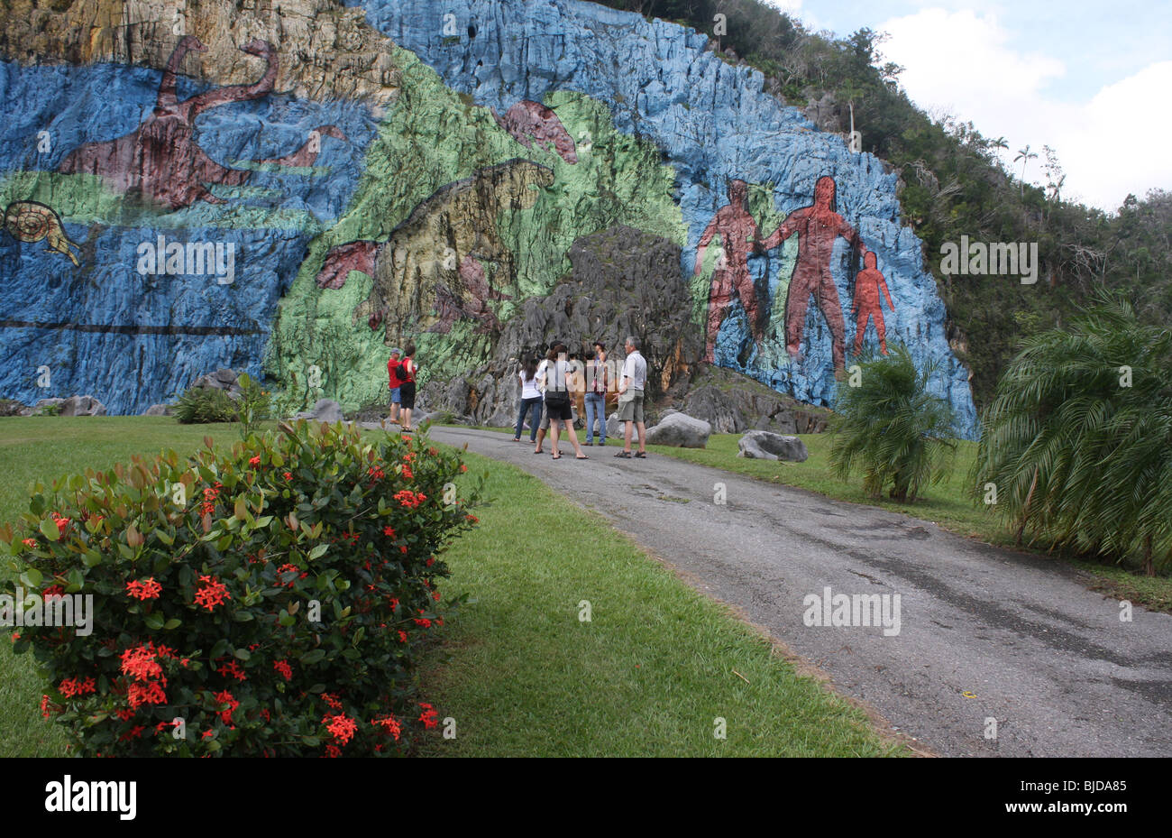 Visitors by the Mural de la Prehistoria in Cuba Stock Photo