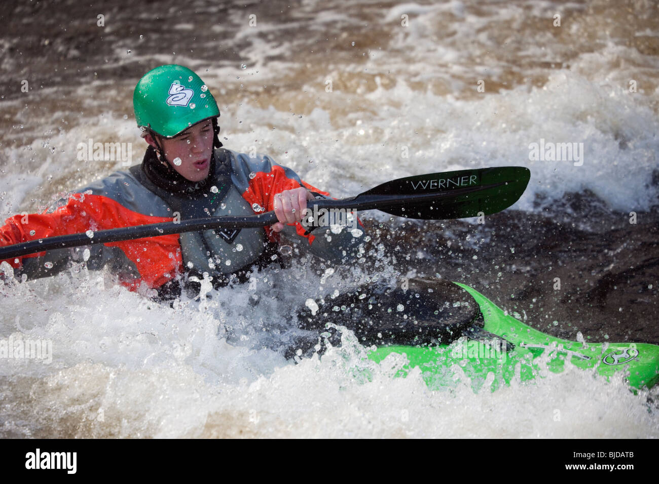 National Whitewater Centre, Frongoch, Gwynedd, North Wales, UK. Kayaker kayaking in white water on Tryweryn River. Stock Photo