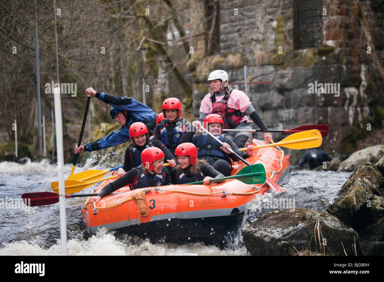 People having fun white water rafting on Tryweryn River at the Welsh