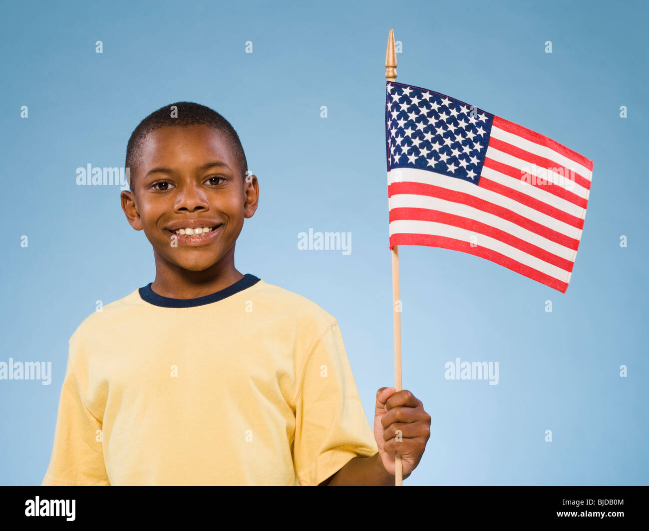 Child with American flag. Stock Photo