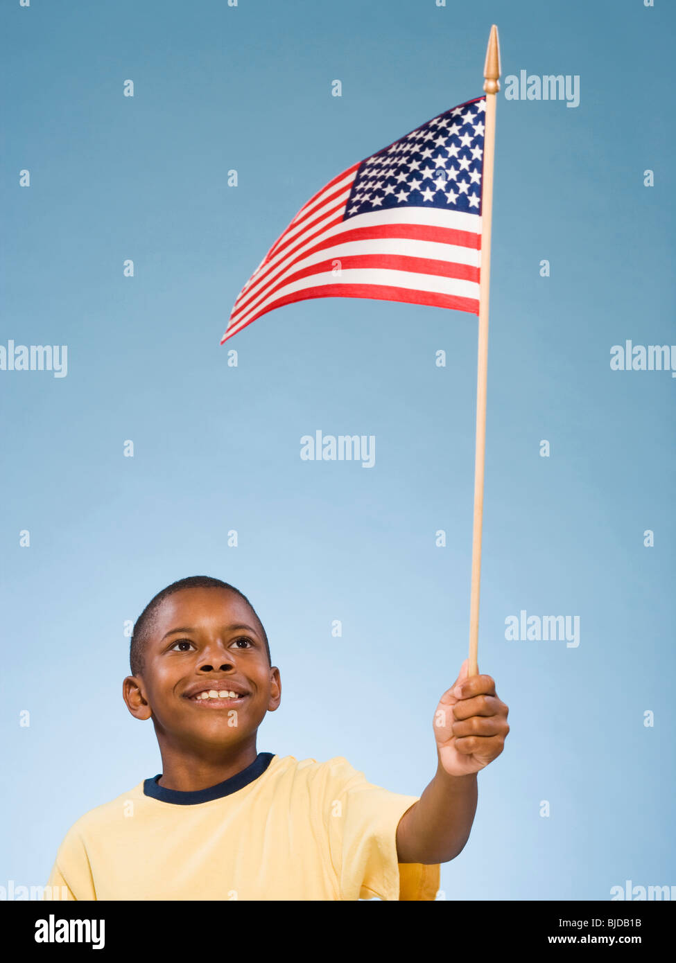 Child with American flag. Stock Photo