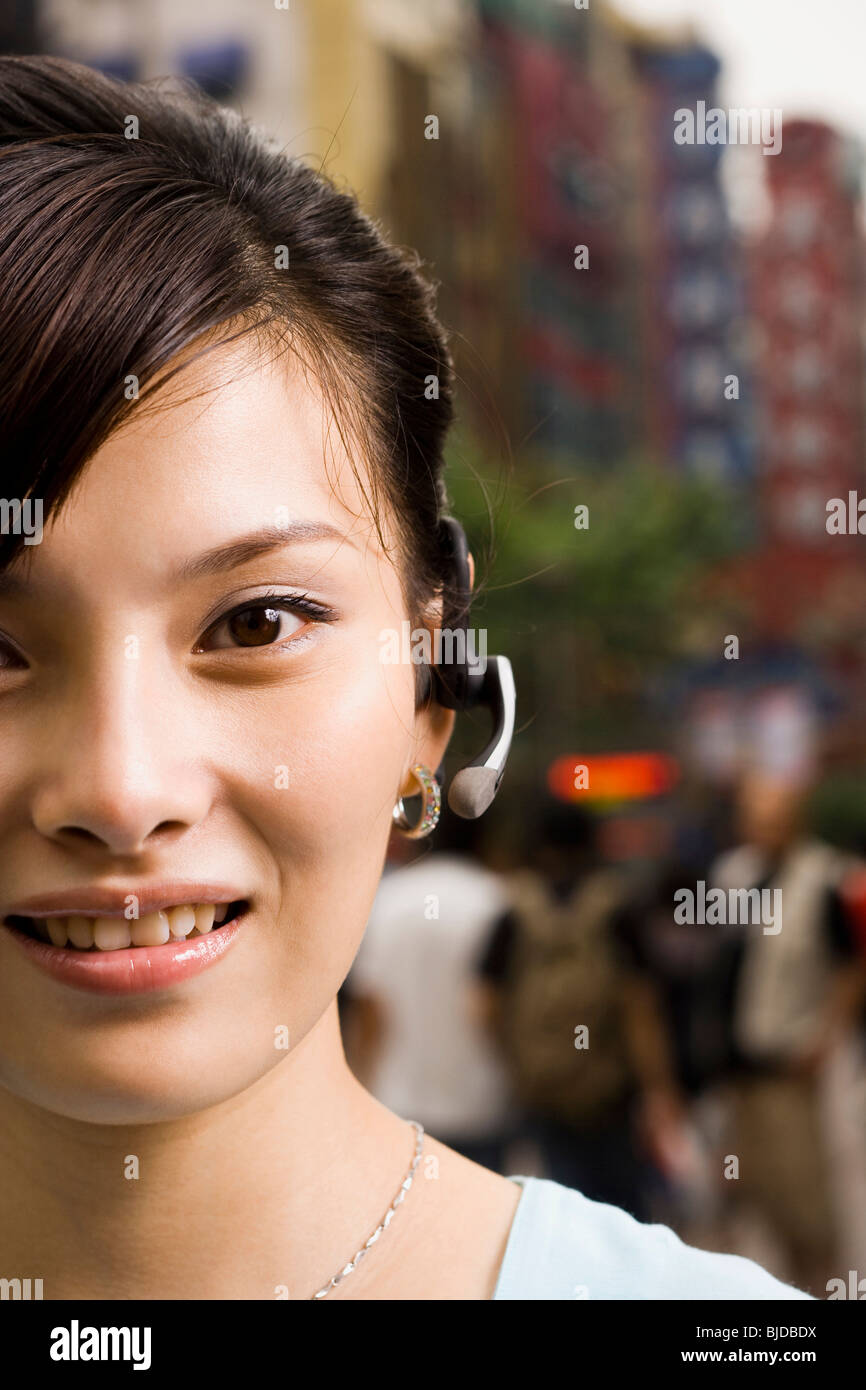 Woman with a cell phone earpiece Stock Photo Alamy