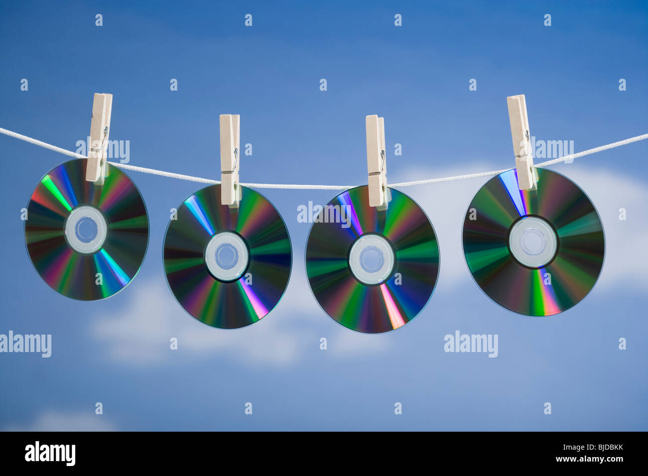 Compact discs hung out to dry. Stock Photo