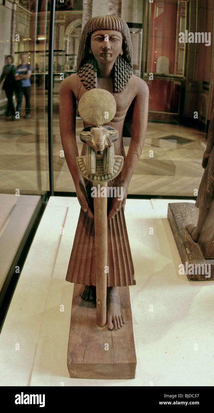 PARIS, France - Louvre Museum, Egyptian Department. Collection, Ancient Art Wooden Statue Stock Photo