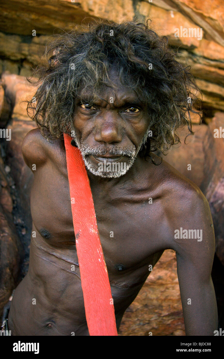 Aboriginal elder Tom Noytuna with red spear at Dukaladjarrang an important rock art site in Arnhem Land NT Australia Stock Photo