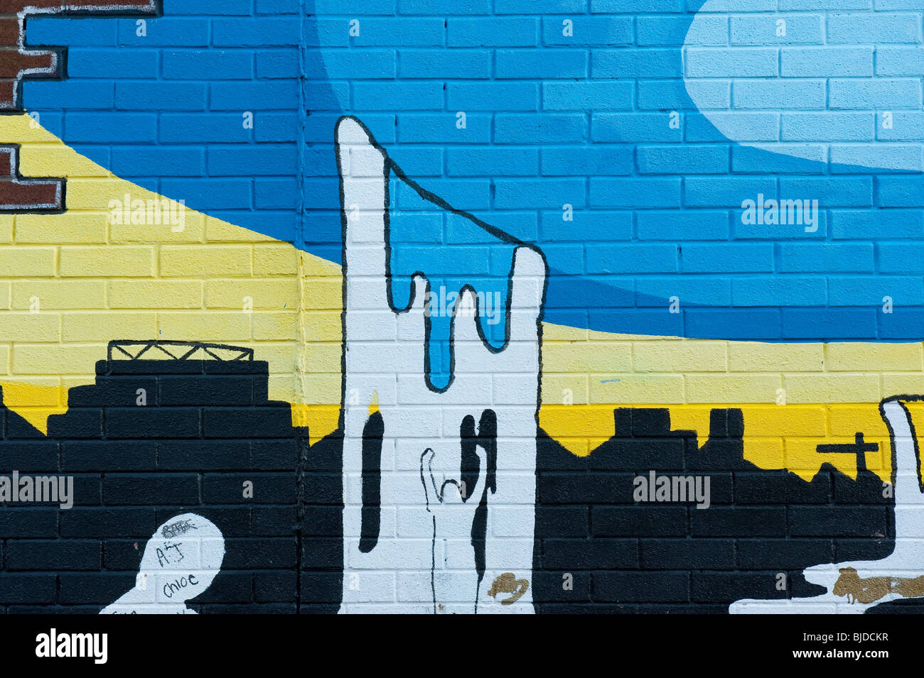 Artwork painting on brick wall of house Stock Photo - Alamy