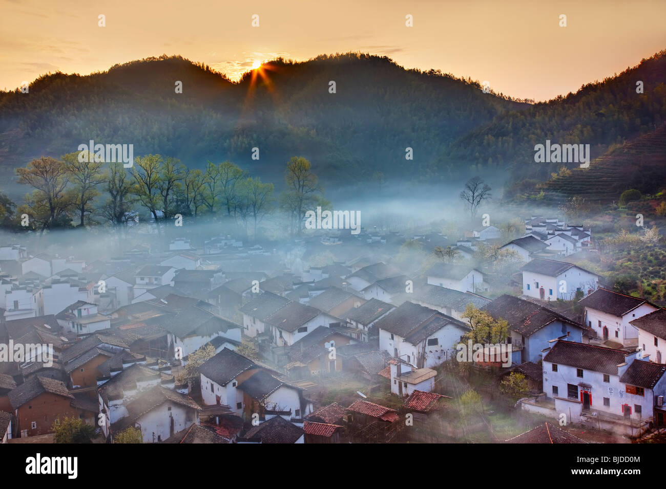 A painterly scene of sunrise with morning mist over Shicheng village, Wuyuan, Jiangxi province, China Stock Photo