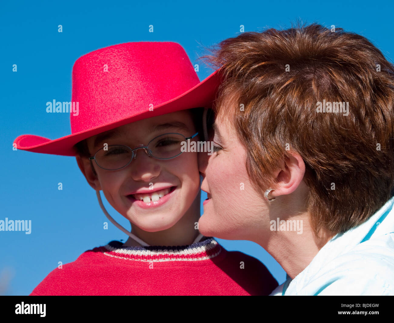 Mom kissing son Stock Photo