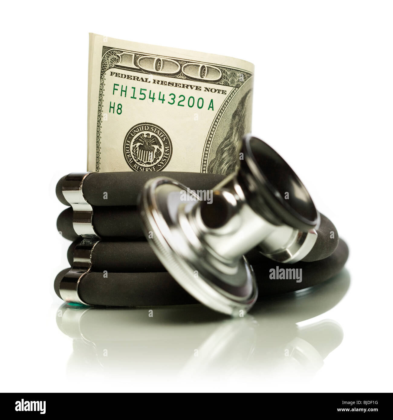 Money wrapped in a stethoscope. Stock Photo