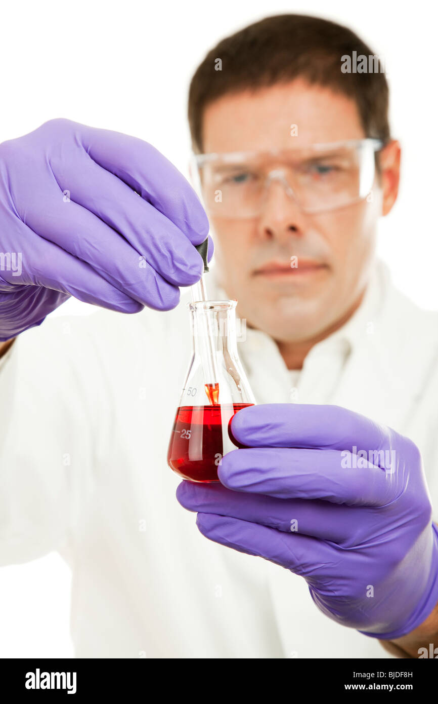 Scientist uses an eye dropper to sample liquid from a flask. Focus on