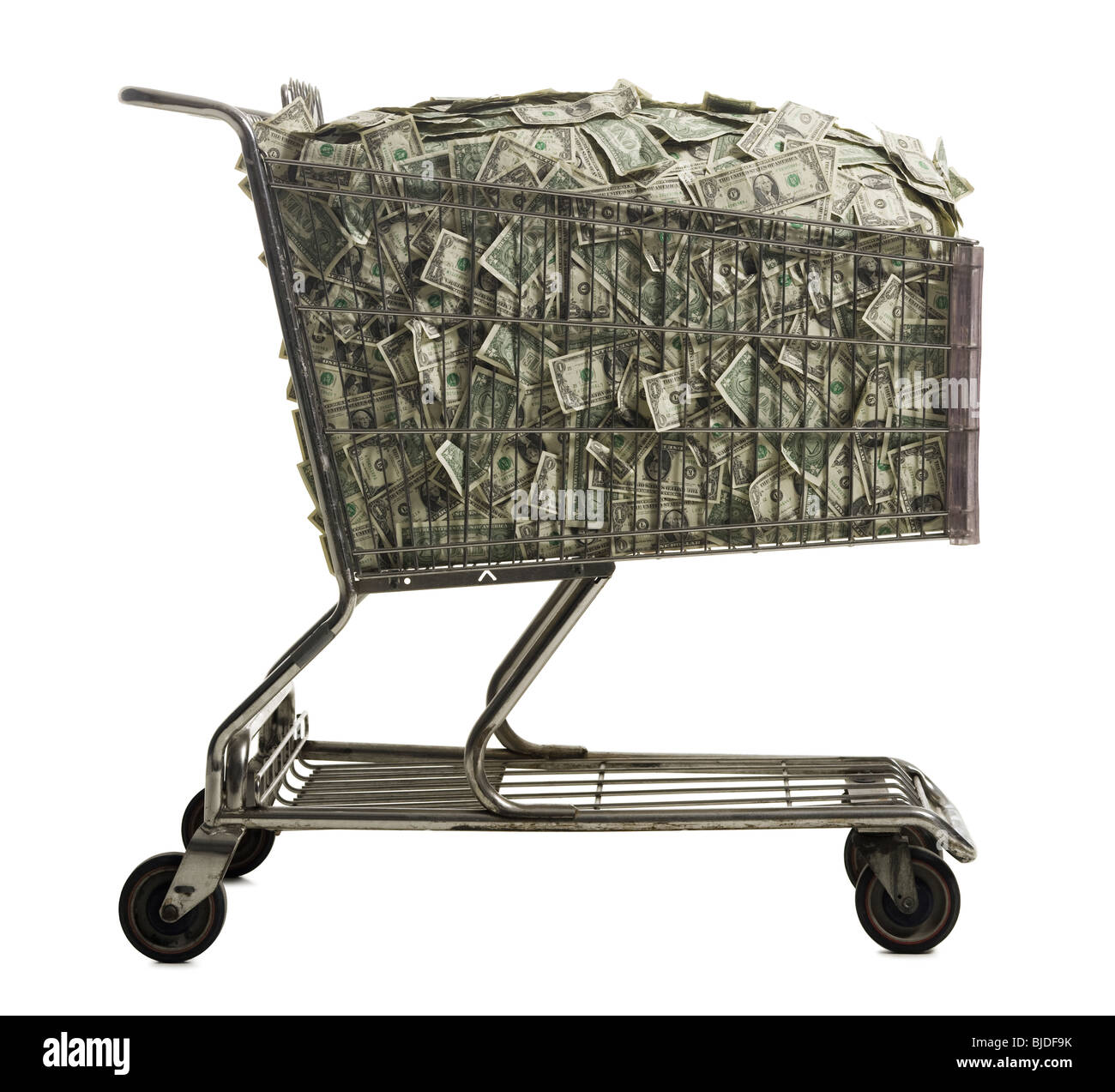 Shopping cart full of American dollars. Stock Photo