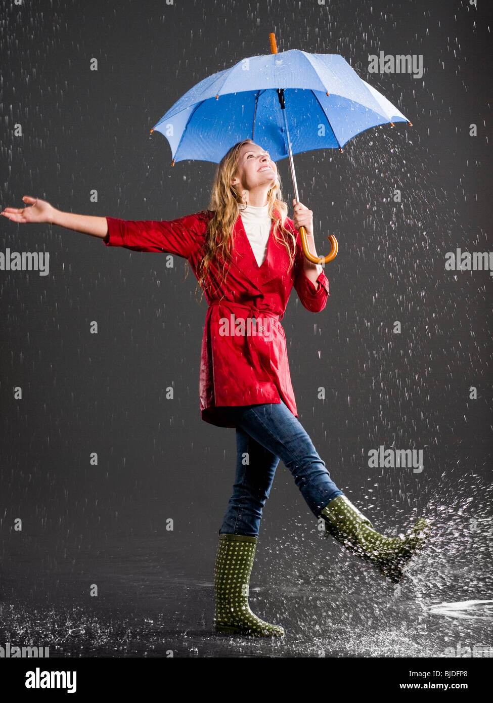 Young woman with an umbrella Stock Photo - Alamy