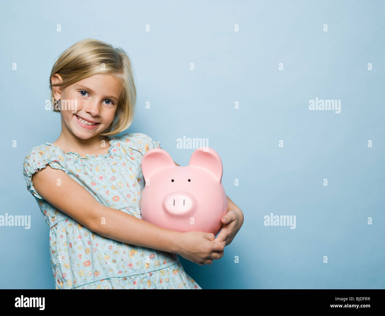 girl with a piggy bank Stock Photo - Alamy
