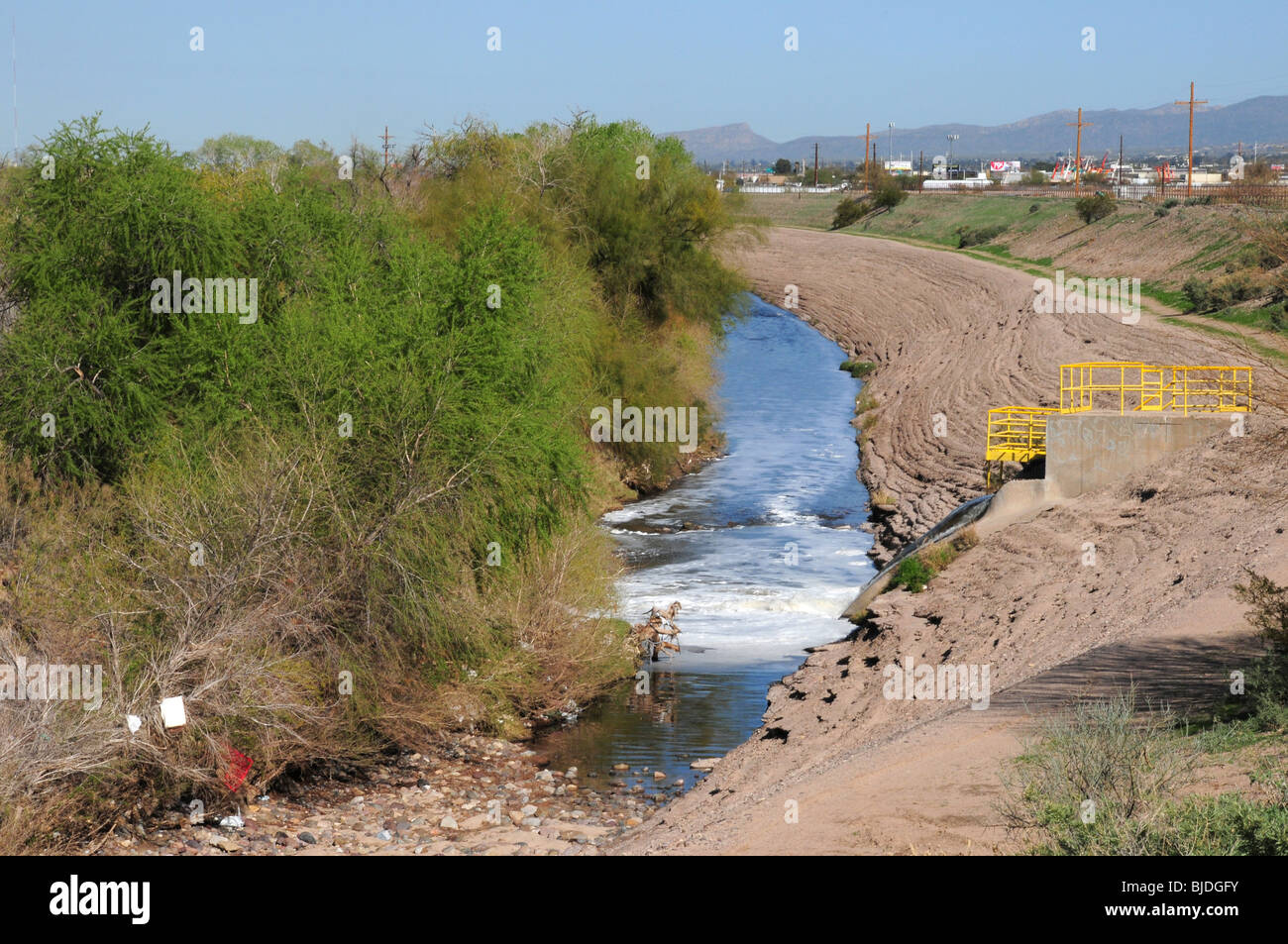 Reclaimed water flows from a water treatment facility into the Santa Cruz River in Tucson