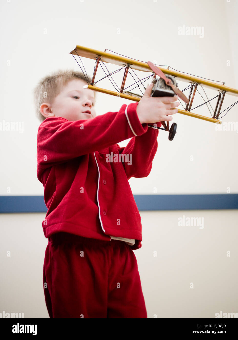 boy playing with a toy plane Stock Photo