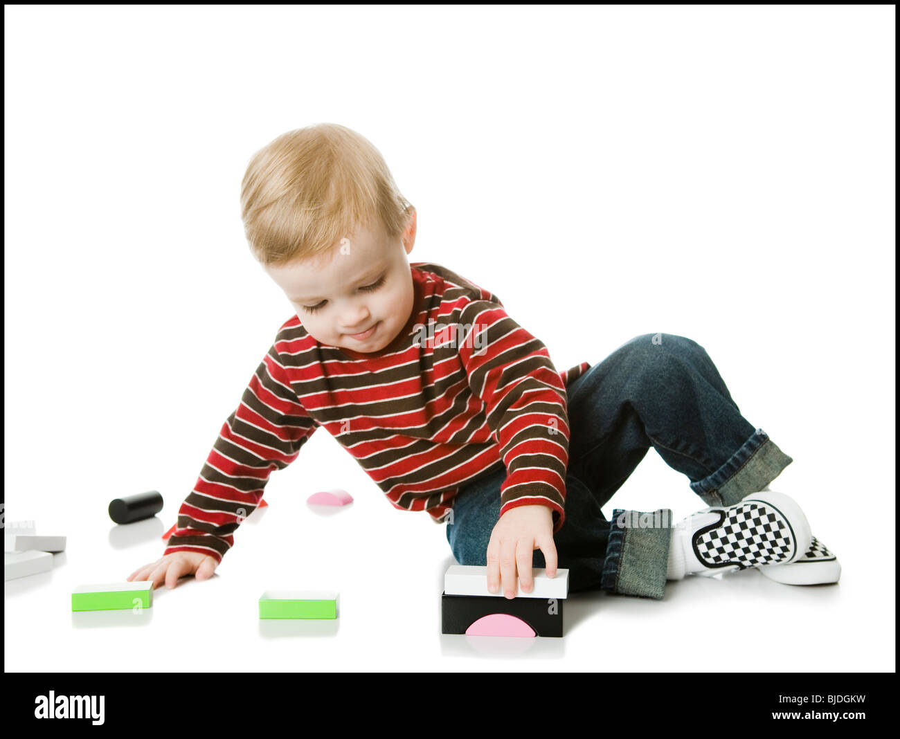 little boy playing with toys Stock Photo - Alamy