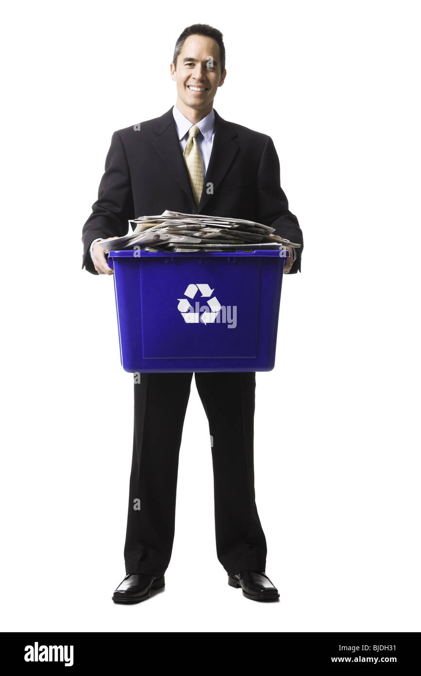 businessperson holding a recycling bin Stock Photo