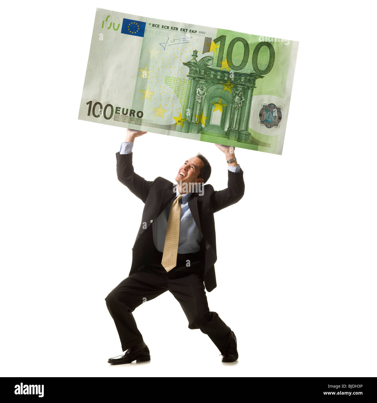 businessperson holding up a bank note Stock Photo
